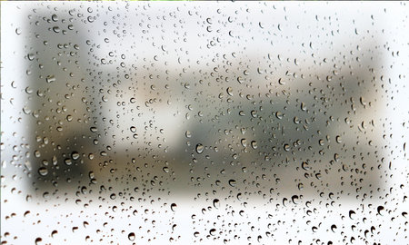 Background with rain drops close up. Rain drops on outdoor window, Closeup view transparent water drops on glass surface, humid water backdrop, blurred background with copy space for your textの写真素材