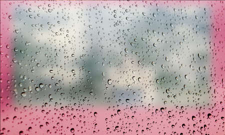 Background with rain drops close up. Rain drops on outdoor window, Closeup view transparent water drops on glass surface, humid water backdrop, blurred background with copy space for your textの写真素材