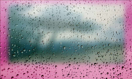 Background with rain drops close up. Rain drops on outdoor window, Closeup view transparent water drops on glass surface, humid water backdrop, blurred background with copy space for your textの写真素材