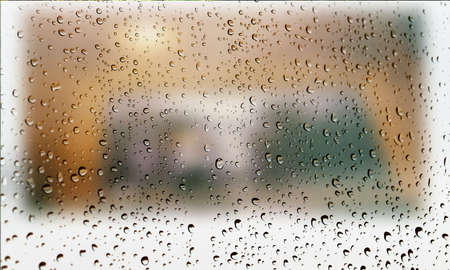 Background with rain drops close up. Rain drops on outdoor window, Closeup view transparent water drops on glass surface, humid water backdrop, blurred background with copy space for your textの写真素材