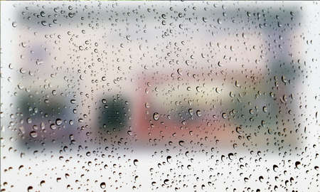 Background with rain drops close up. Rain drops on outdoor window, Closeup view transparent water drops on glass surface, humid water backdrop, blurred background with copy space for your textの写真素材