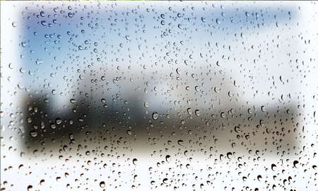 Background with rain drops close up. Rain drops on outdoor window, Closeup view transparent water drops on glass surface, humid water backdrop, blurred background with copy space for your textの写真素材