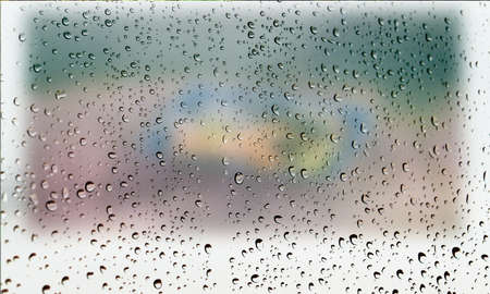 Background with rain drops close up. Rain drops on outdoor window, Closeup view transparent water drops on glass surface, humid water backdrop, blurred background with copy space for your textの写真素材