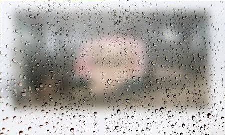 Background with rain drops close up. Rain drops on outdoor window, Closeup view transparent water drops on glass surface, humid water backdrop, blurred background with copy space for your textの写真素材