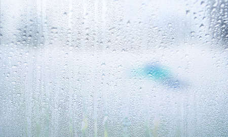 Background with rain drops close up. Rain drops on outdoor window, Closeup view transparent water...