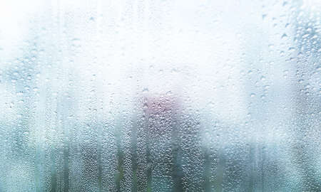 Background with rain drops close up. Rain drops on outdoor window, Closeup view transparent water...