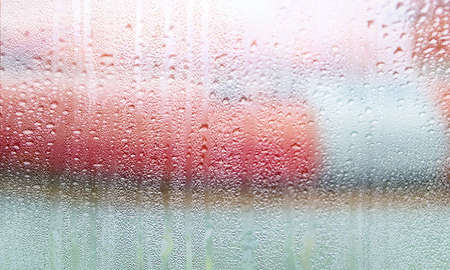 Background with rain drops close up. Rain drops on outdoor window, Closeup view transparent water...
