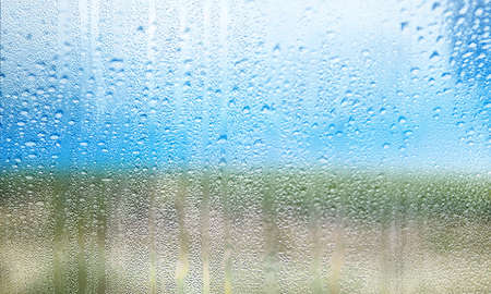 Background with rain drops close up. Rain drops on outdoor window, Closeup view transparent water...