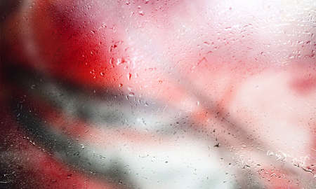 Background with rain drops close up. Rain drops on outdoor window, Closeup view transparent water drops on glass surface, humid water backdrop, blurred background with copy space for your textの写真素材