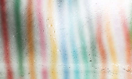 Background with rain drops close up. Rain drops on outdoor window, Closeup view transparent water drops on glass surface, humid water backdrop, blurred background with copy space for your textの写真素材