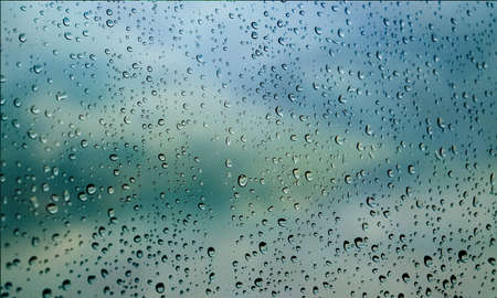 Background with rain drops close up. Rain drops on outdoor window, Closeup view transparent water...