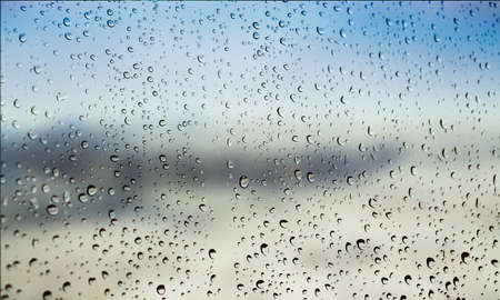 Background with rain drops close up. Rain drops on outdoor window, Closeup view transparent water...