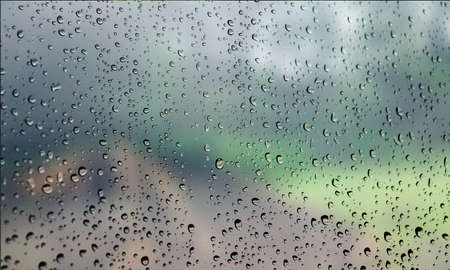 Background with rain drops close up. Rain drops on outdoor window, Closeup view transparent water...