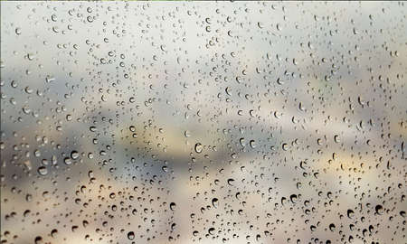 Background with rain drops close up. Rain drops on outdoor window, Closeup view transparent water...