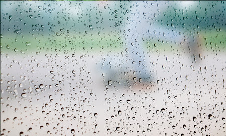 Background with rain drops close up. Rain drops on outdoor window, Closeup view transparent water...