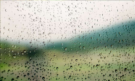 Background with rain drops close up. Rain drops on outdoor window, Closeup view transparent water...