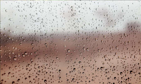 Background with rain drops close up. Rain drops on outdoor window, Closeup view transparent water...