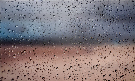 Background with rain drops close up. Rain drops on outdoor window, Closeup view transparent water...