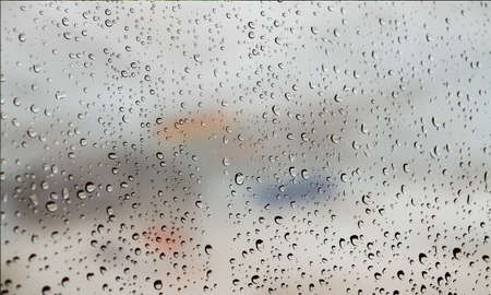 Background with rain drops close up. Rain drops on outdoor window, Closeup view transparent water...