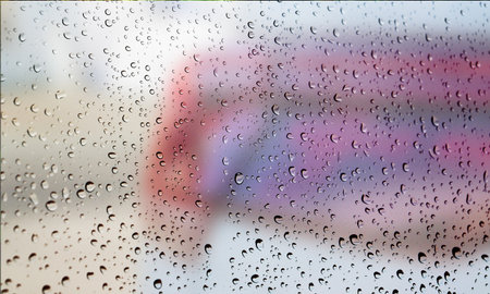 Background with rain drops close up. Rain drops on outdoor window, Closeup view transparent water...