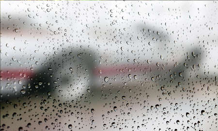 Background with rain drops close up. Rain drops on outdoor window, Closeup view transparent water...