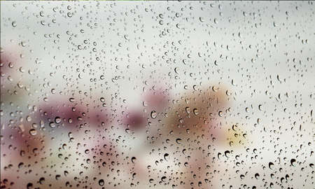 Background with rain drops close up. Rain drops on outdoor window, Closeup view transparent water...