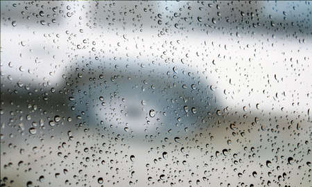 Background with rain drops close up. Rain drops on outdoor window, Closeup view transparent water...