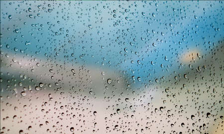 Background with rain drops close up. Rain drops on outdoor window, Closeup view transparent water...