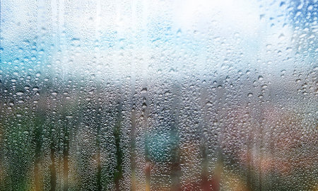 Condensation on window glass, closeup view. Rainy weather