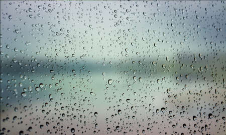 Background with rain drops close up. Rain drops on outdoor window, Closeup view transparent water...