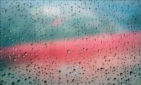 Background with rain drops close up. Rain drops on outdoor window, Closeup view transparent water...