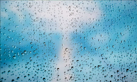 Background with rain drops close up. Rain drops on outdoor window, Closeup view transparent water...