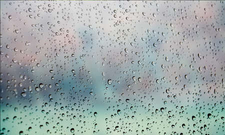 Background with rain drops close up. Rain drops on outdoor window, Closeup view transparent water...
