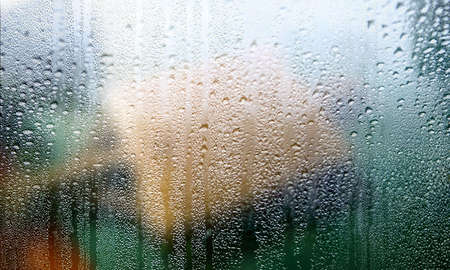 Condensation on the window. Rain drops on the glass close-up