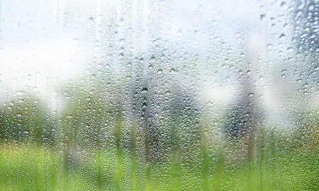 Background with rain drops close up. Rain drops on outdoor window, Closeup view transparent water...