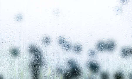 Drops of rain on window, closeup. Rainy weather
