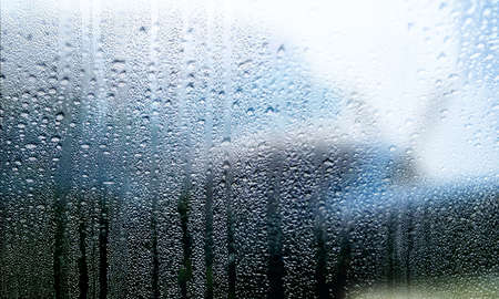 Condensation on the window. Raindrops on the glass. Rainy weather.