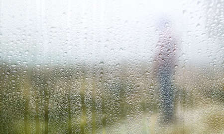 Rain drops on the window. Selective focus. Blurred background.