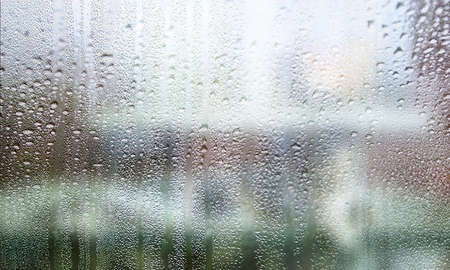 Drops of rain on the window, abstract background, selective focus
