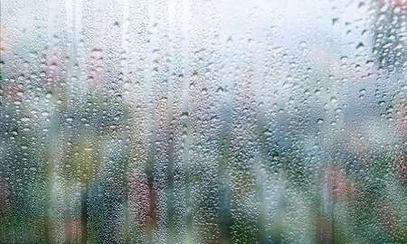 Background with rain drops close up. Rain drops on outdoor window, Closeup view transparent water...