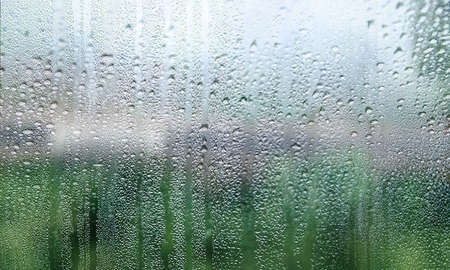 Background with rain drops close up. Rain drops on outdoor window, humid water backdrop, blurred...