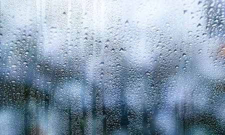 Background with rain drops close up. Rain drops on outdoor window, Closeup view transparent water...