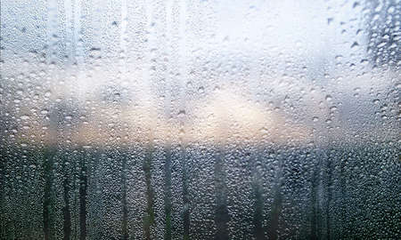 Condensation on the window. Raindrops on the window glass.