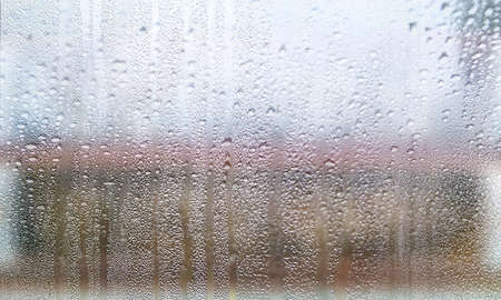 Water drops on window glass background, closeup view. Rainy weather