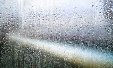Condensation on the glass. Rain drops on the window. Abstract background.