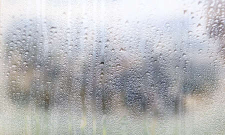 Water drops on the window glass. Rain drops on the window.