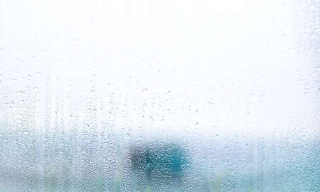 Condensation on the window. Water drops on the glass. Abstract background.