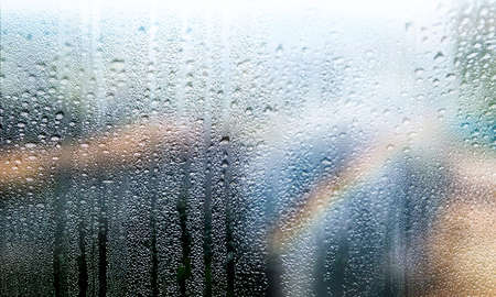 Condensation on the window. Rain drops on the window, close-up.の写真素材