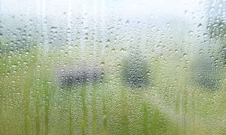 Condensation on the window. Rain drops on the glass. Natural background.
