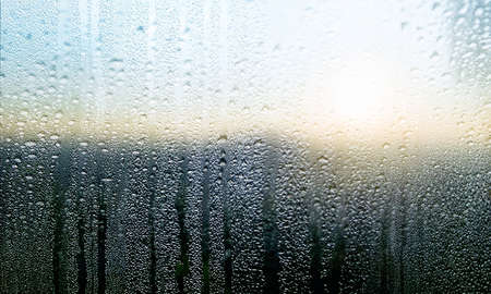 Condensation on the window. Water drops on the glass. Raindrops on the window.
